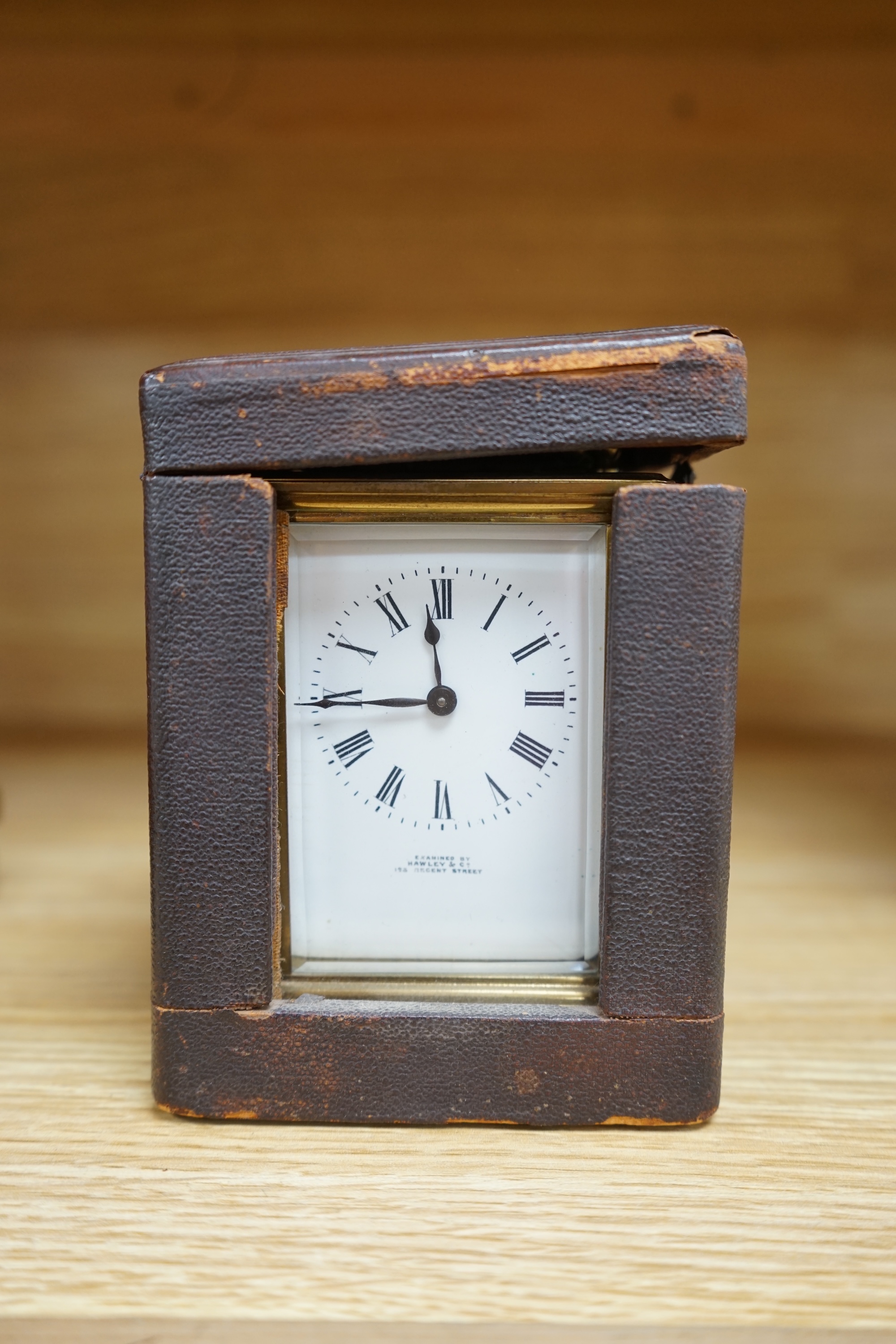 A cased brass carriage timepiece and a dome topped Edwardian mantel clock striking on a coiled gong, backplate stamped BTG, 29.5cm (2) Condition - fair to good.